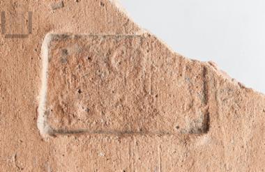 Part of a stamped roof tile of Thasos