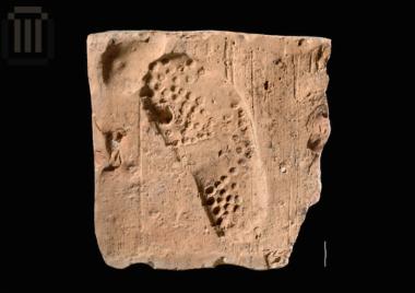 Brick with 'impression' of a human footprint