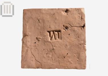 Stamped brick,'ΤΝ'(upside down)