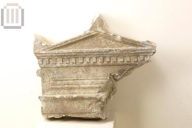 Part of funerary stele with a pedimental crowning