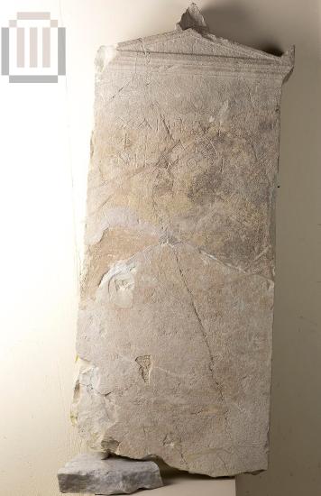 Inscribed funerary stele with a pedimental crowning