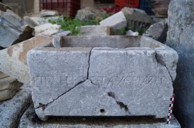 Inscribed stone ossuary reused as a tub