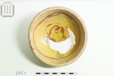 Part of glass coated pottery bowl