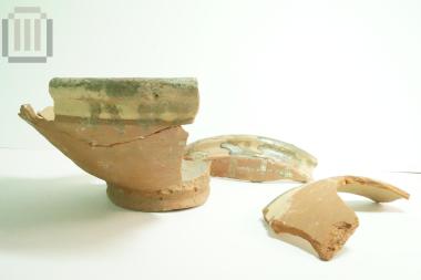 Part of glass coated pottery bowl