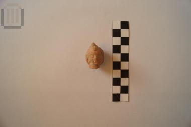 Κεφάλι πήλινου ειδωλίου παιδικής μορφής