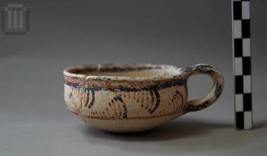 Miniature one-handled semiglobular cup