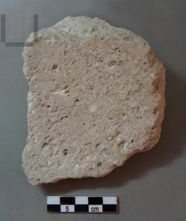 Fragment of a grinding slab