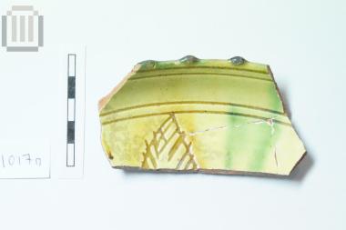 Fragment of glass coated pottery bowl