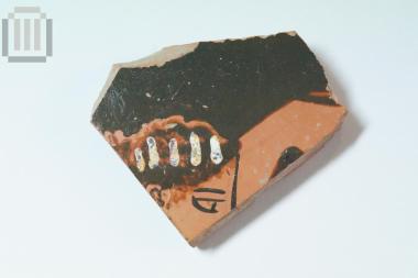 Fragment of red on black vase
