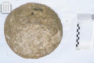 Part of a spherical stone bullet