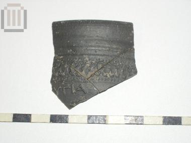 Part of a skyphos with relief moldmade decoration