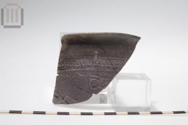 Part of a skyphos with relief moldmade decoration