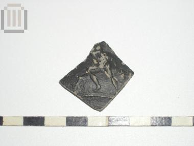 Part of a skyphos with relief moldmade decoration