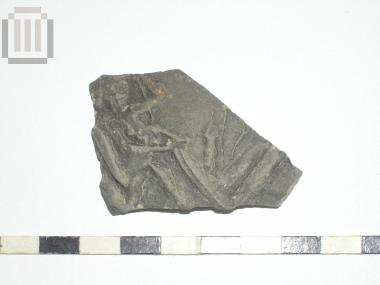 Part of a skyphos with relief moldmade decoration