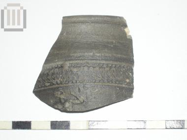 Part of a skyphos with relief moldmade decoration