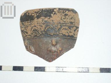Part of a skyphos with relief moldmade decoration
