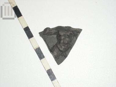 Sherd of skyphos with relief moldmade decoration