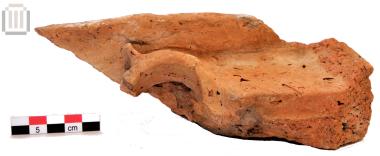 Fragment of a clay house model