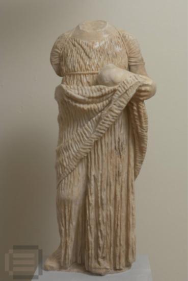 Statuette of a girl, holding a dove.