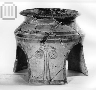 Tripod base of vase.