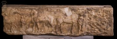 Base of a stele with relief  horses scene.