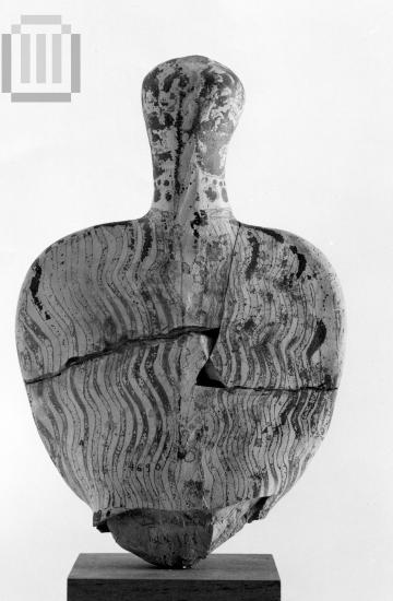 The upper part of a  mycenean female figurine of the Φ type.
