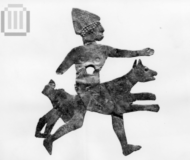 Sheet metal  in the shape of a hunter and his dog.