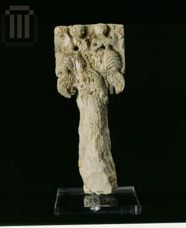 Ivory handle of a mirror,  with relief decoration.