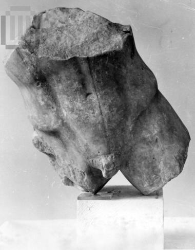Part of a nude male figure