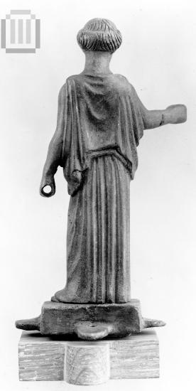Mirror's support in the form of a Peploforos. Perhaps Artemis holding a torch.