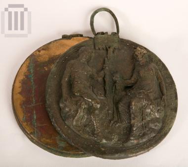 Folding mirror  decorated with a scene in relief.