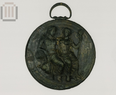 Folding mirror  decorated with a scene in relief.