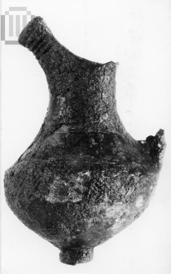 Bronze pendant in the form of  a juglet.