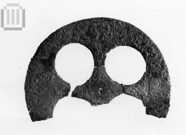 Part of pendant in the shape of a small wheel with four spokes