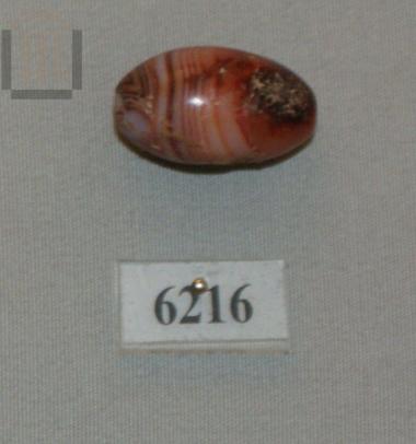Stone lenticular bead.
