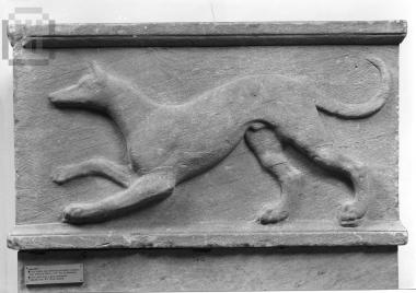 Relief plaque  with  a scene  of a tracking dog.