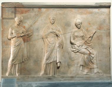 Slab with three muses  in relief.