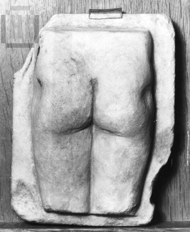 Votive plaque with a human body in relief.