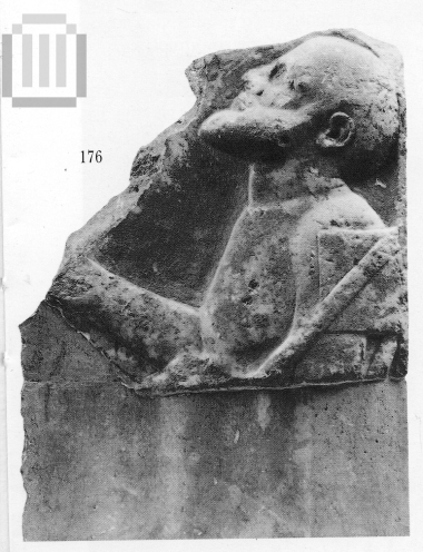 Fragment from a funerary  stele  with a bearded man in relief.