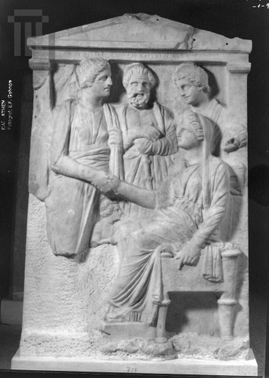Funerary  inscribed  stele  with decoration in relief.