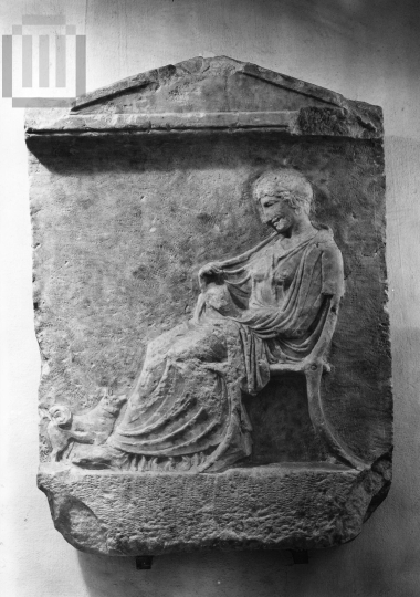 Funerary  inscribed  stele  with decoration in relief.