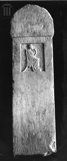 Funerary  inscribed  stele  with decoration in relief.