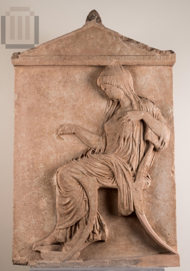 Funerary stele with a seated female figure.
