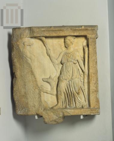 Part from a votive relief with Artemis holding torches.