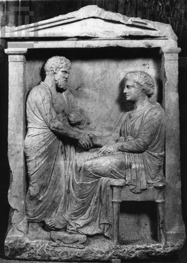 Funerary inscribed stele with decoration in relief.