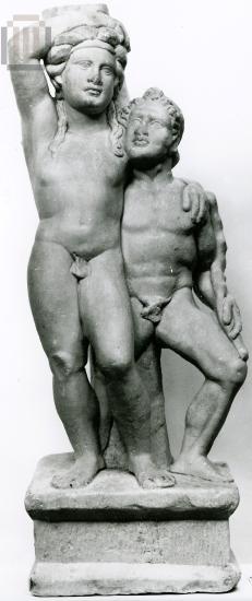 Table support with statue group with limbs entwined of Satyr and Dionysus.