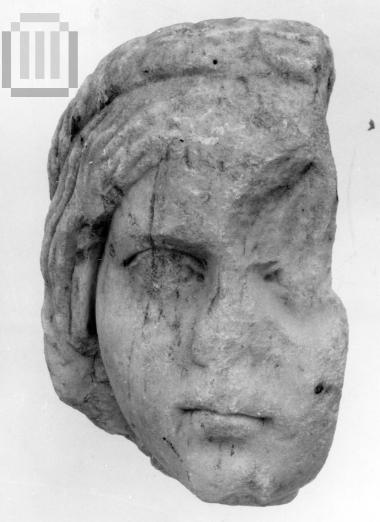Head of a  young female statue.