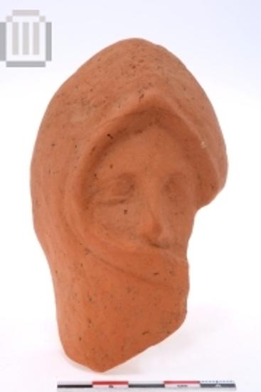 Clay  head of female figurine