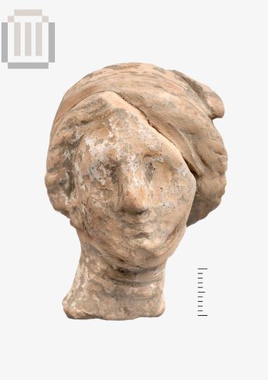 Κεφαλή πήλινου γυναικείου ειδωλίου από το Δυμόκαστρο
