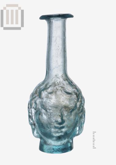 Glass unguentarium in the form of a human double-faced head,  from Mazarakia